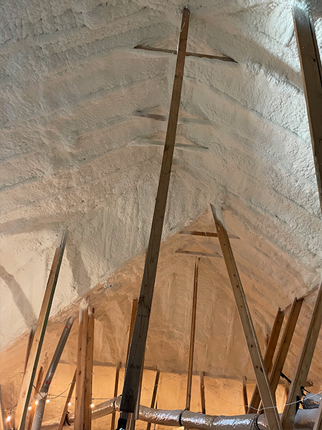 Mustang Insulation technician installing blown-in attic insulation in a DFW home